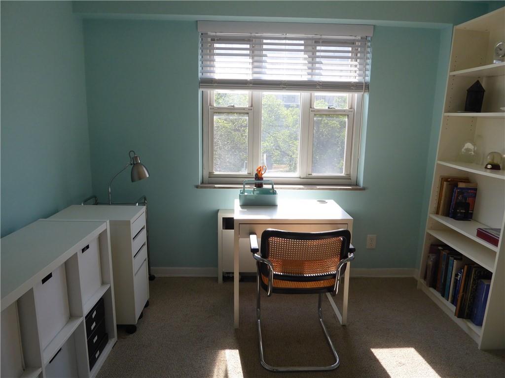 4601 Fifth Avenue, Unit 623 Pittsburgh, PA 15213 - Photo 21 of 28 a room with a chair and a table