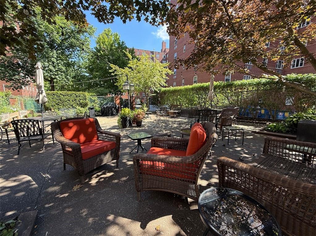 4601 Fifth Avenue, Unit 623 Pittsburgh, PA 15213 - Photo 26 of 28 an outdoor sitting area with furniture and wooden floor