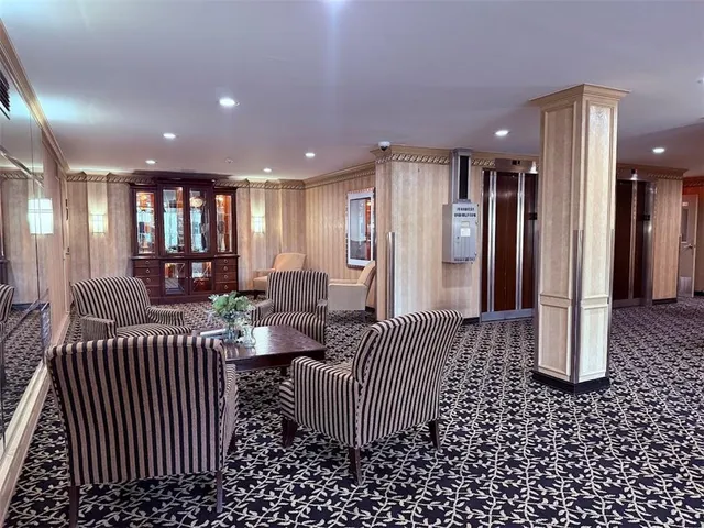 a view of a hallway with dining area