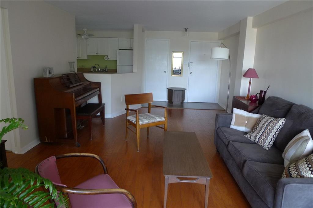 4601 Fifth Avenue, Unit 623 Pittsburgh, PA 15213 - Photo 9 of 28 a living room with furniture and wooden floor