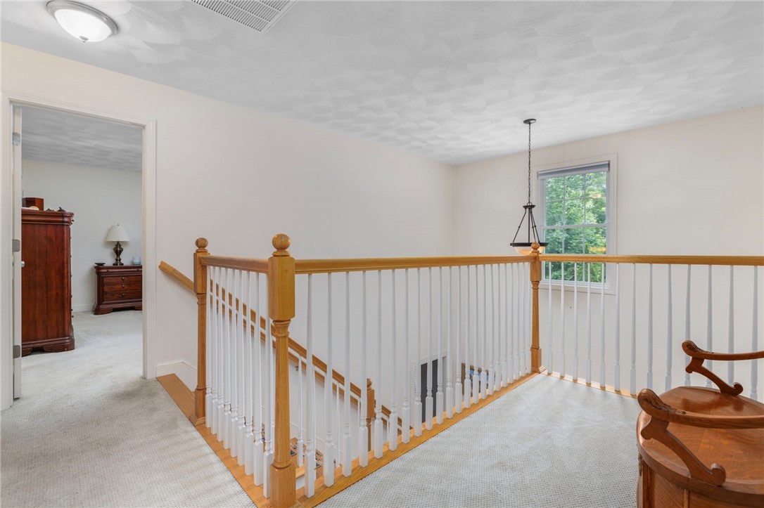 321 River Road Lincoln, RI 02865 - Photo 17 of 45 The second level has a long landing and an overlook.