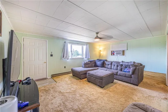 a living room with furniture and a window