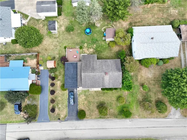 an aerial view of residential house with outdoor space