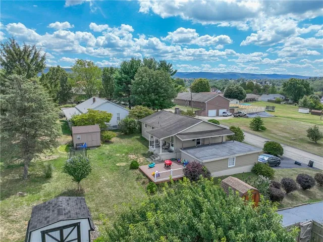 an aerial view of a houses with outdoor space