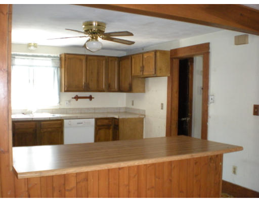 43 Corona Street Springfield, MA 01104 - Photo 8 of 9 a kitchen with stainless steel appliances granite countertop a sink a stove and a refrigerator