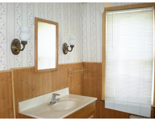 43 Corona Street Springfield, MA 01104 - Photo 9 of 9 a bathroom with a sink and a mirror