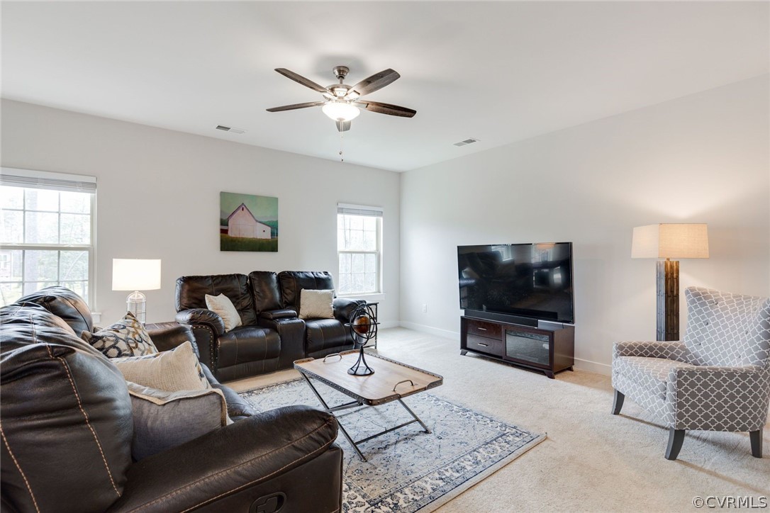 10419 Centralia Station Chester, VA 23831 - Photo 49 of 50 a living room with furniture and a flat screen tv