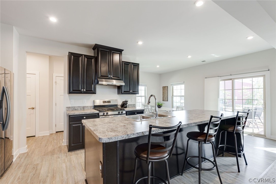 10419 Centralia Station Chester, VA 23831 - Photo 19 of 50 a kitchen with granite countertop a sink stove and refrigerator