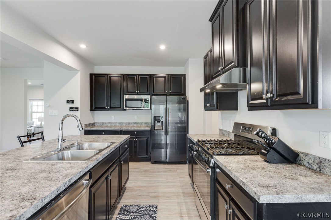 10419 Centralia Station Chester, VA 23831 - Photo 23 of 50 a kitchen with stainless steel appliances granite countertop a sink stove and refrigerator