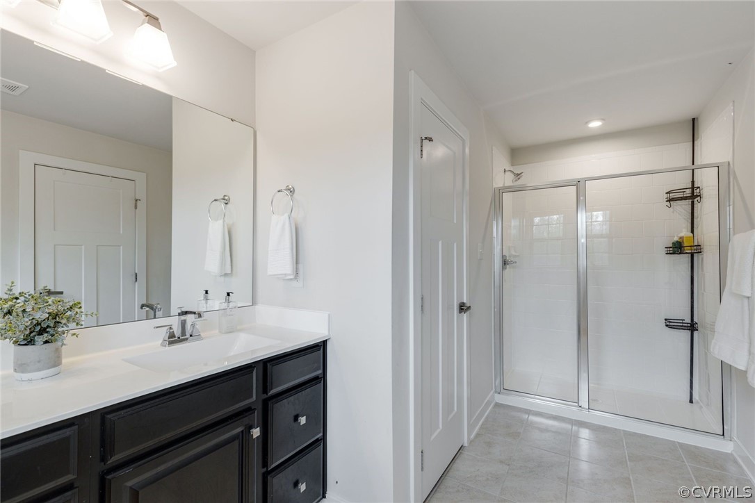 10419 Centralia Station Chester, VA 23831 - Photo 34 of 50 a bathroom with a shower sink vanity and mirror