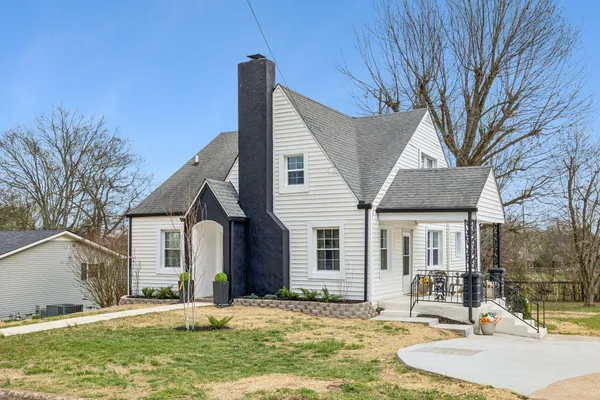a front view of a house with garden