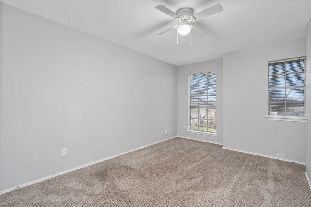 911 Flatters Way Pflugerville, TX 78660 - Photo 20 of 31 a view of an empty room with a window