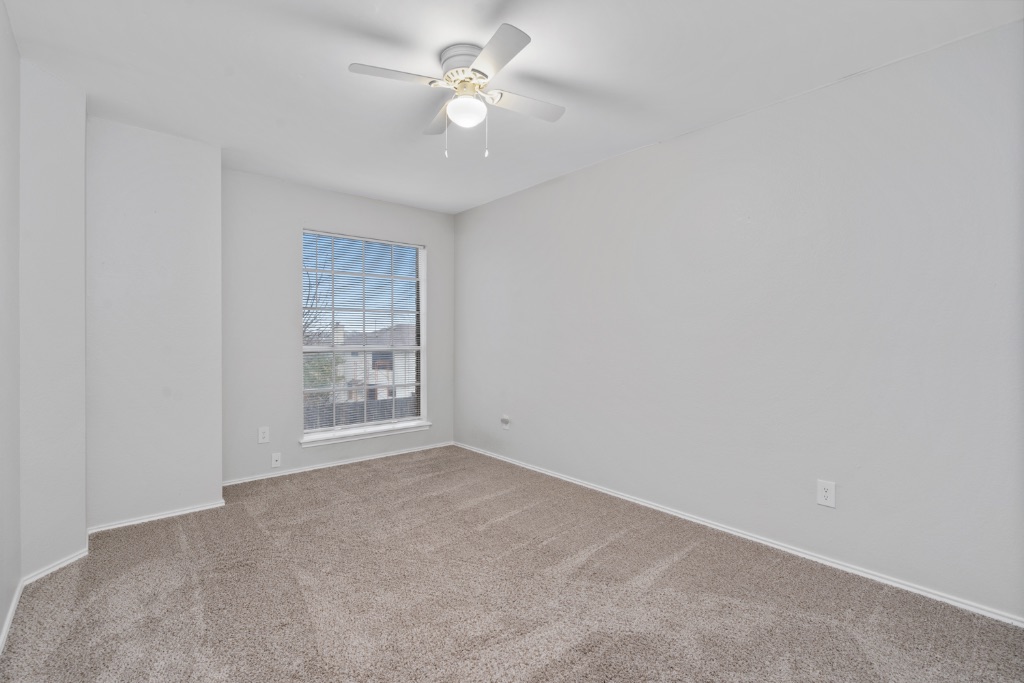 911 Flatters Way Pflugerville, TX 78660 - Photo 22 of 31 a view of an empty room with a window