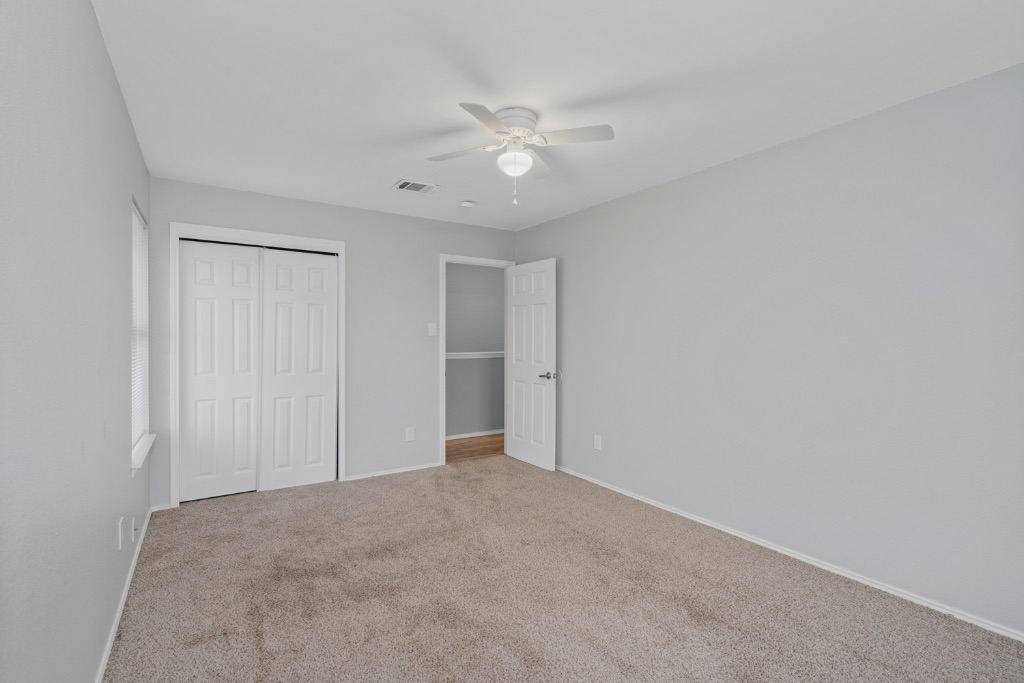 911 Flatters Way Pflugerville, TX 78660 - Photo 27 of 31 a view of a livingroom with a ceiling fan and window