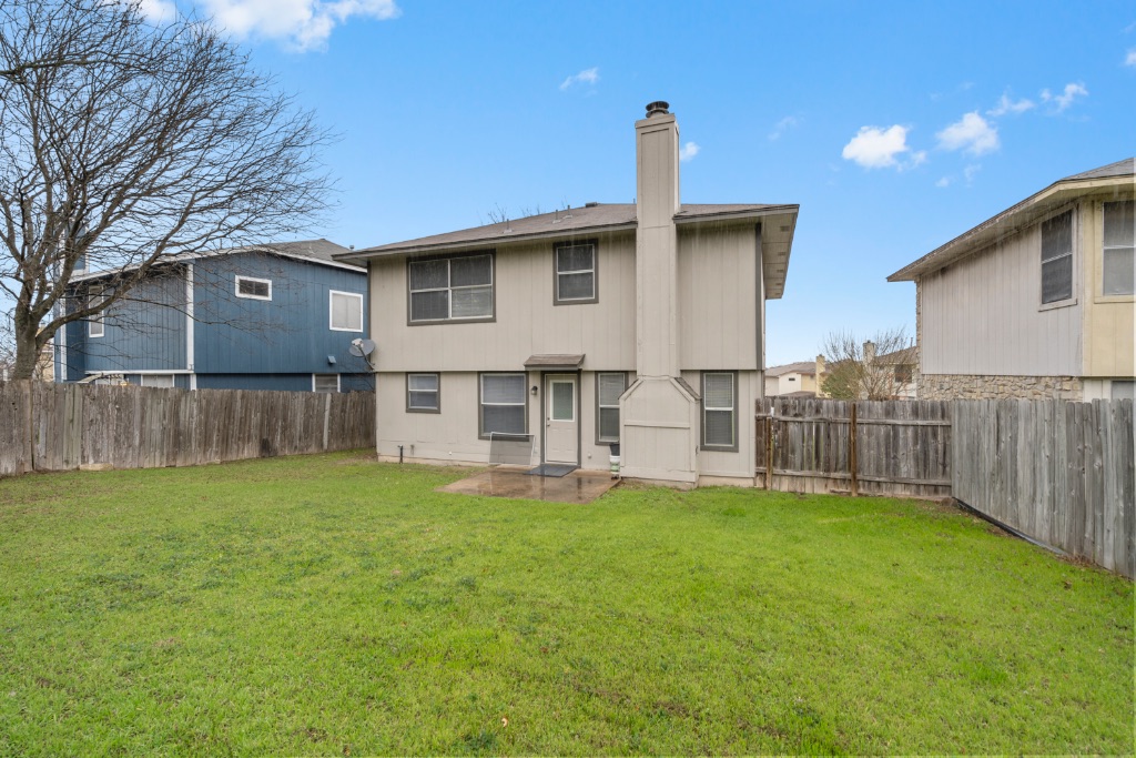 911 Flatters Way Pflugerville, TX 78660 - Photo 29 of 31 a view of a house with a yard and wooden fence
