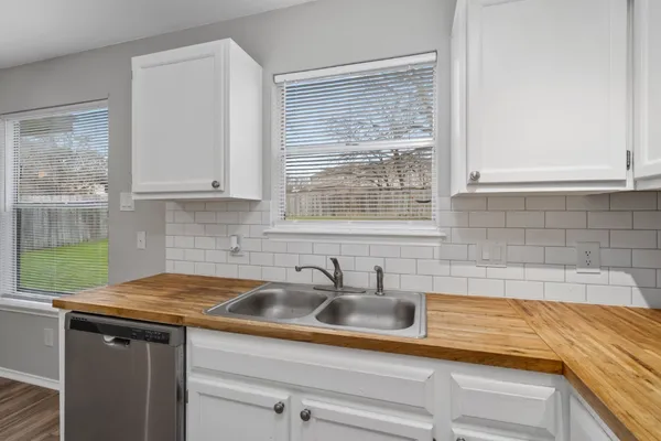a kitchen with a sink and cabinets