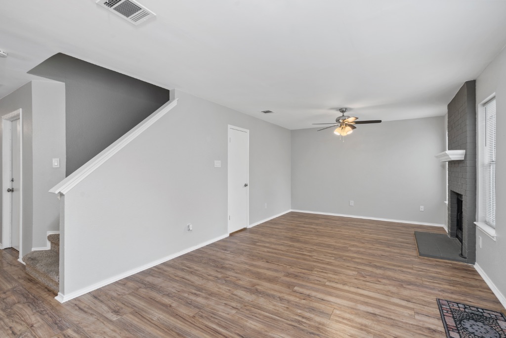 911 Flatters Way Pflugerville, TX 78660 - Photo 10 of 31 a view of empty room with wooden floor