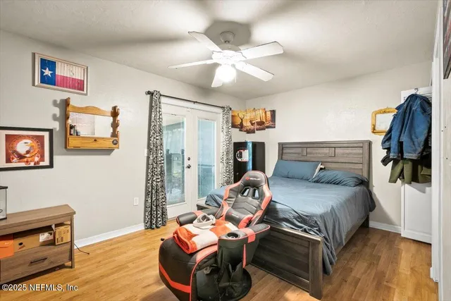 a bedroom with furniture and a chandelier