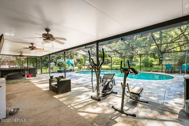 a view of a swimming pool with a patio