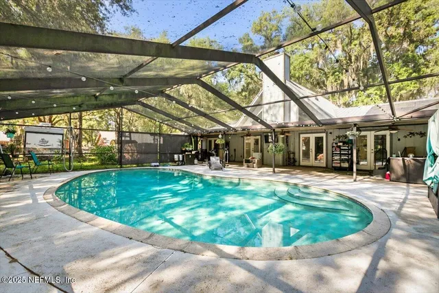 a view of a house with yard and a tree