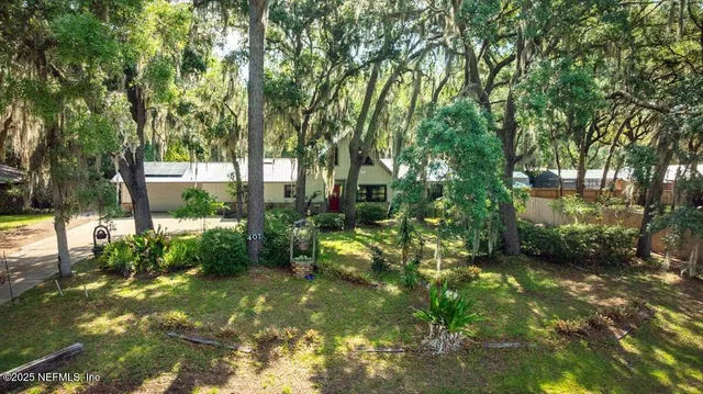 a backyard of a house with lots of green space