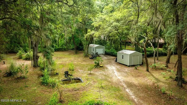 a backyard of a house with lots of green space
