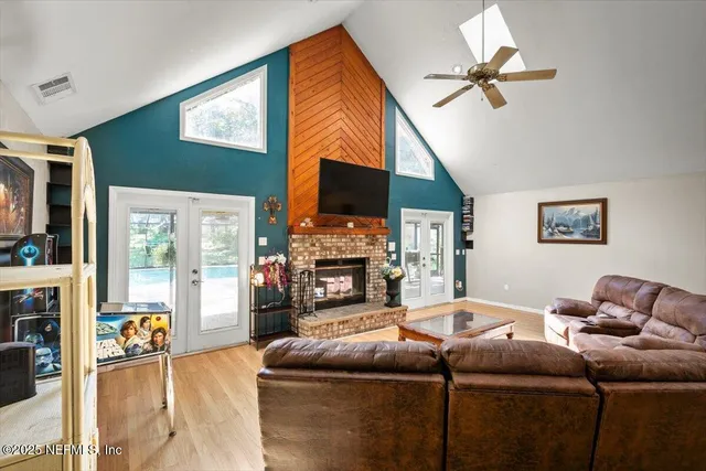 a living room with fireplace furniture and a flat screen tv
