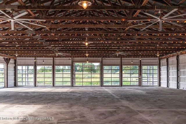 a view of a house with a backyard and a tree
