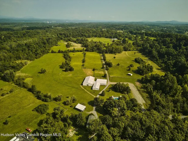 a view of a dining room with furniture and a window