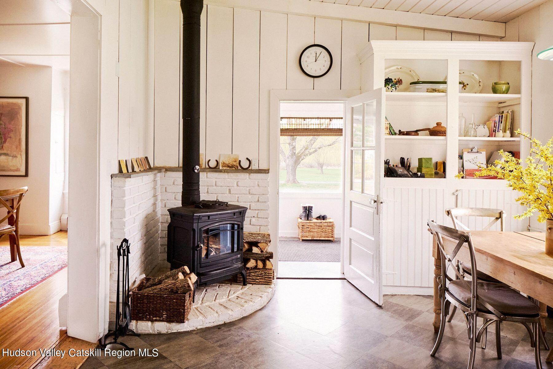 356 Co Rte 6 Germantown, NY 12526 - Photo 21 of 52 a view of a dining room with furniture a rug and wooden floor