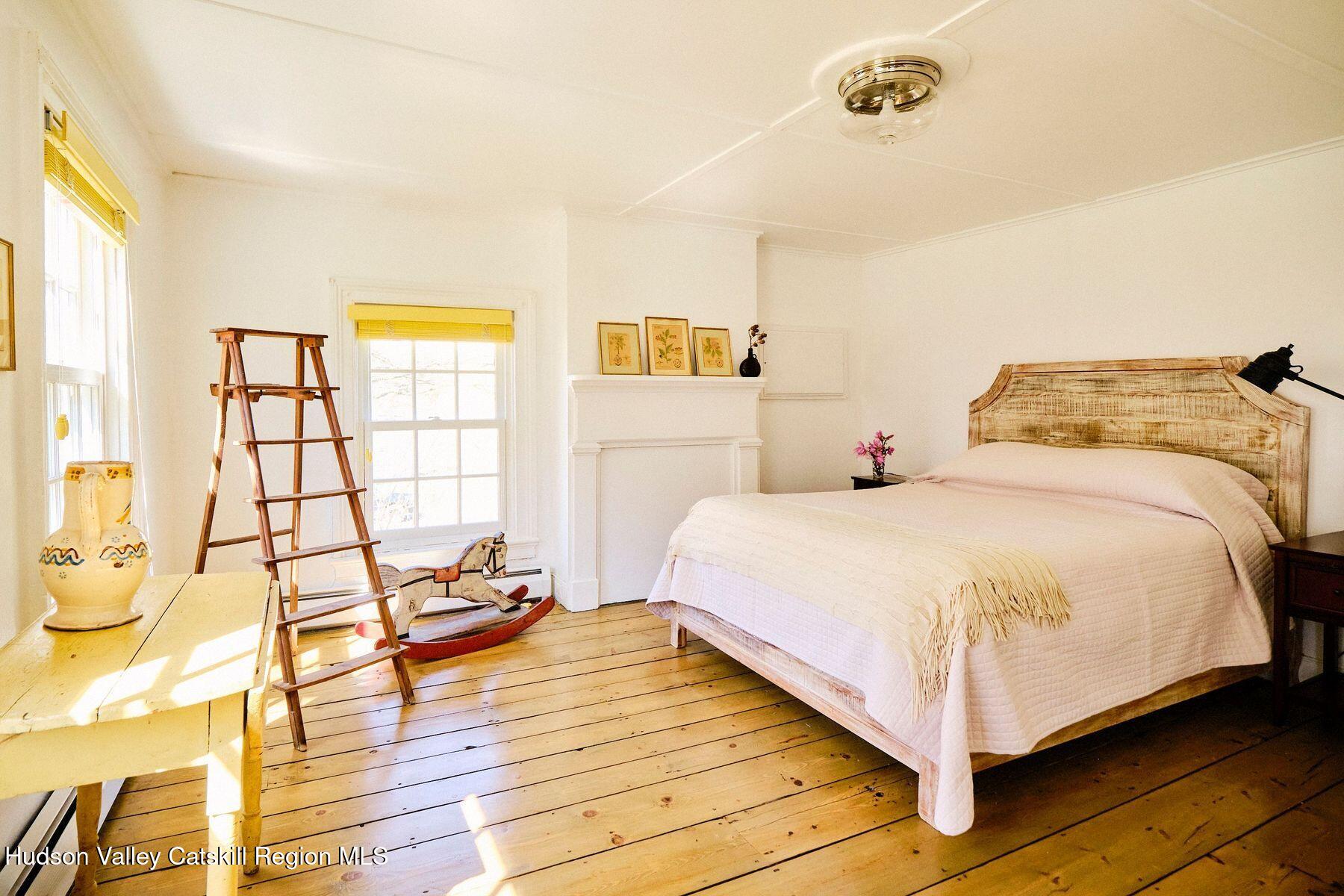 356 Co Rte 6 Germantown, NY 12526 - Photo 27 of 52 a bedroom with a bed and wooden floor