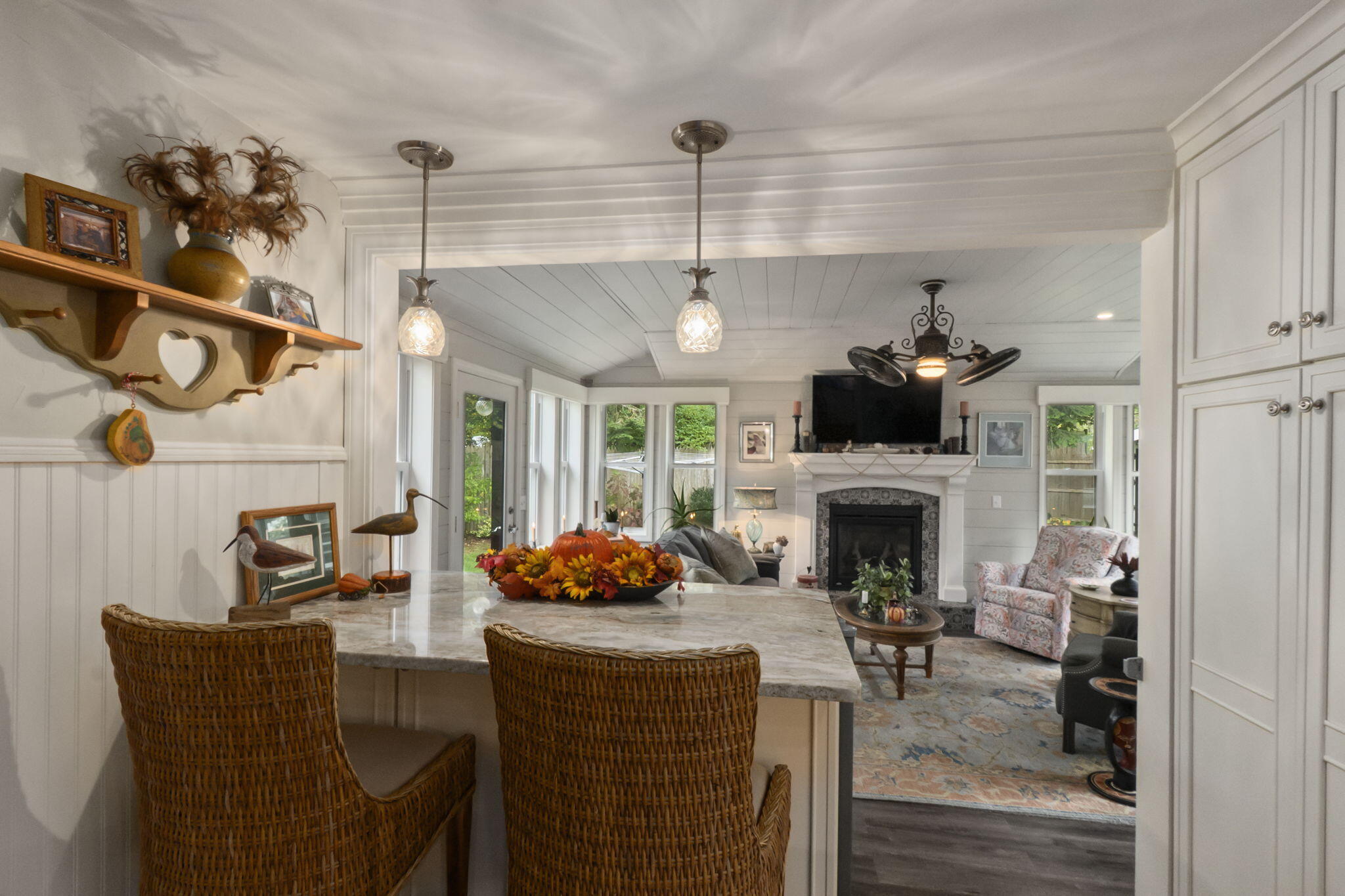 8 Jib Way Hyannis, MA 02601 - Photo 11 of 40 a living room with furniture a fireplace and a chandelier