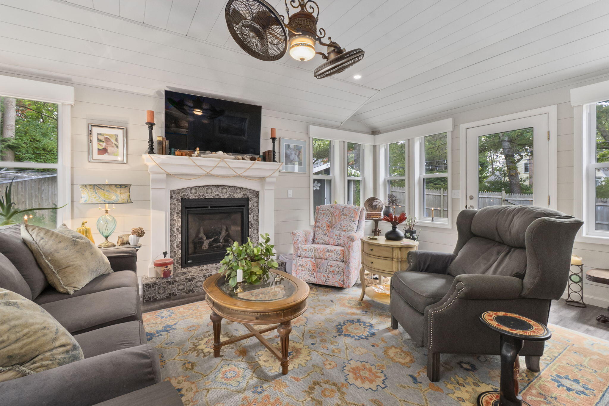 8 Jib Way Hyannis, MA 02601 - Photo 12 of 40 a living room with furniture a flat screen tv and a fireplace
