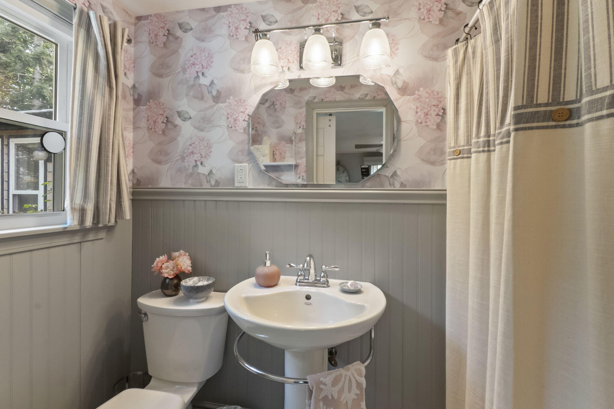 8 Jib Way Hyannis, MA 02601 - Photo 23 of 40 a bathroom with a toilet sink and mirror