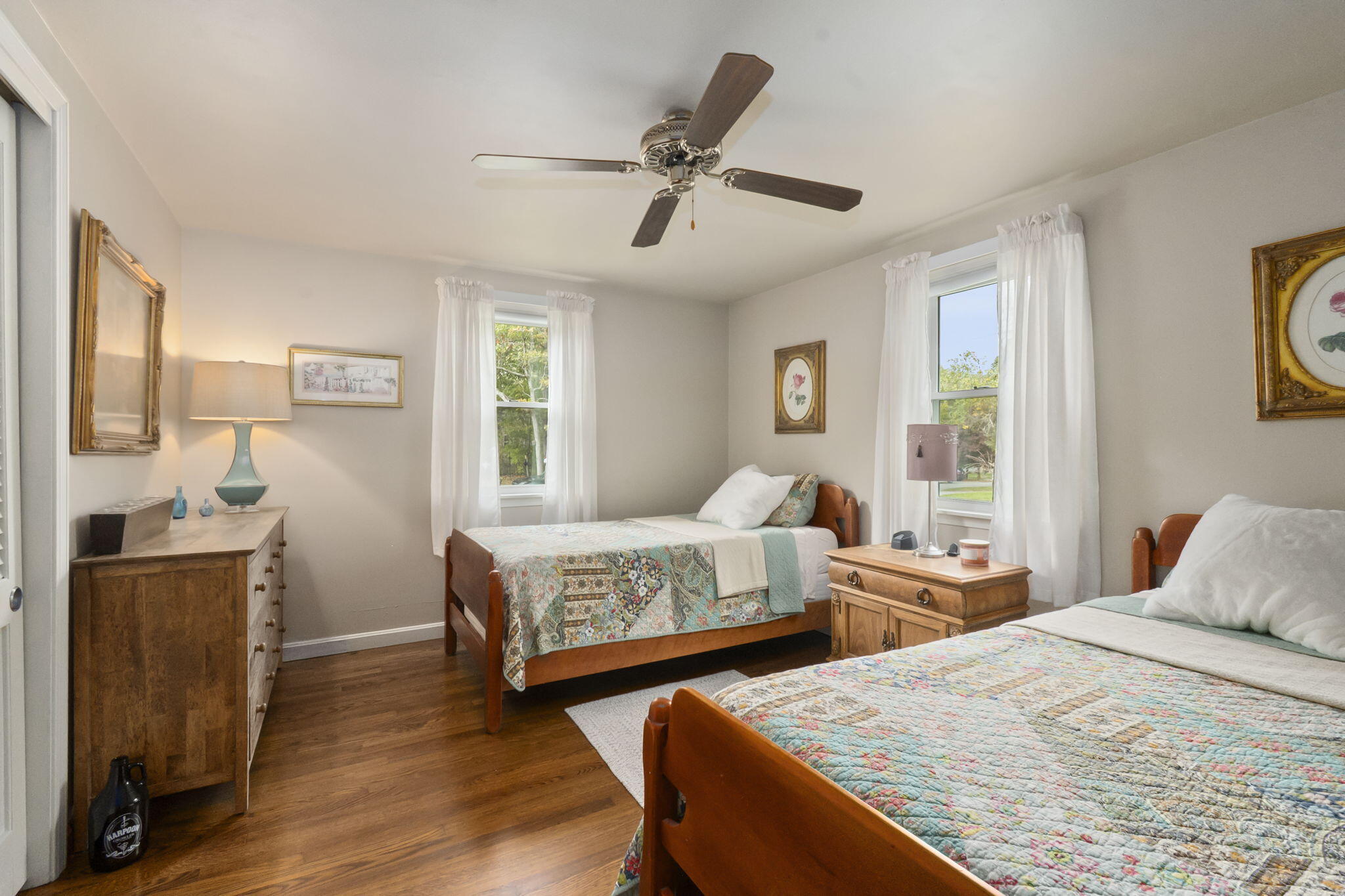 8 Jib Way Hyannis, MA 02601 - Photo 24 of 40 a bedroom with two beds and painting on the wall