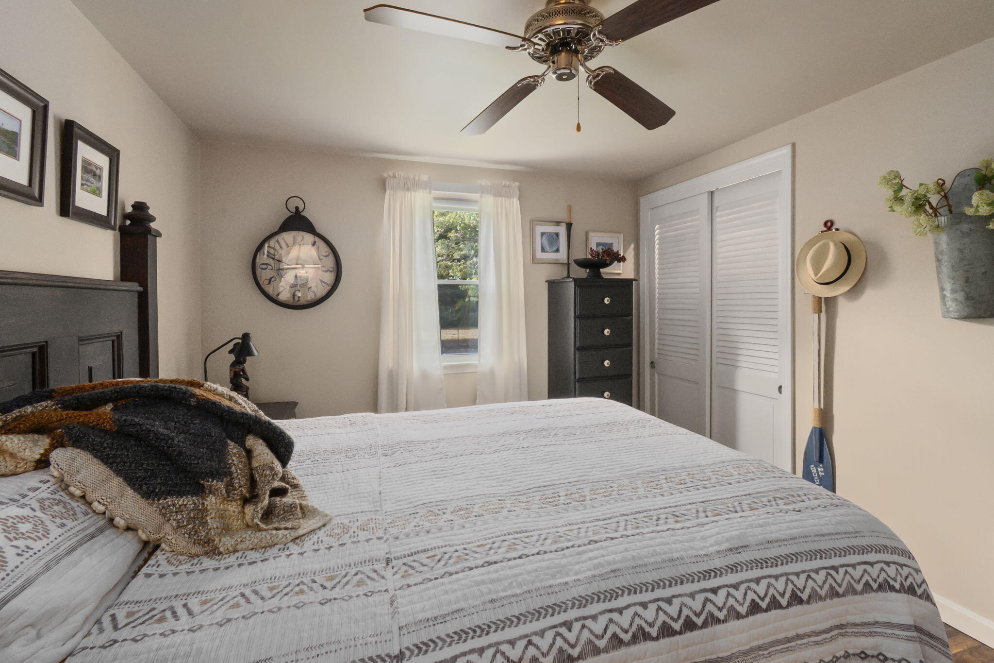 8 Jib Way Hyannis, MA 02601 - Photo 27 of 40 a bedroom with a bed and a chandelier