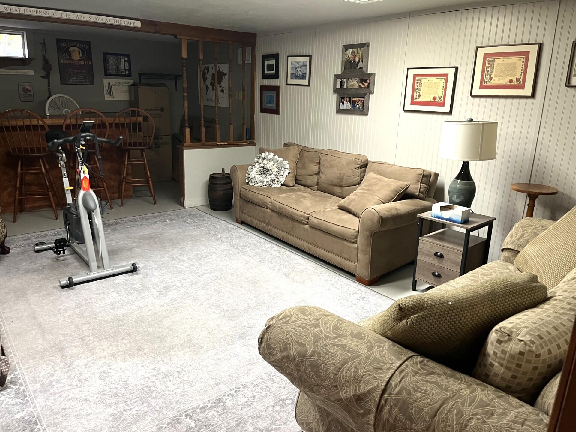 8 Jib Way Hyannis, MA 02601 - Photo 30 of 40 a living room with furniture and a gym machine