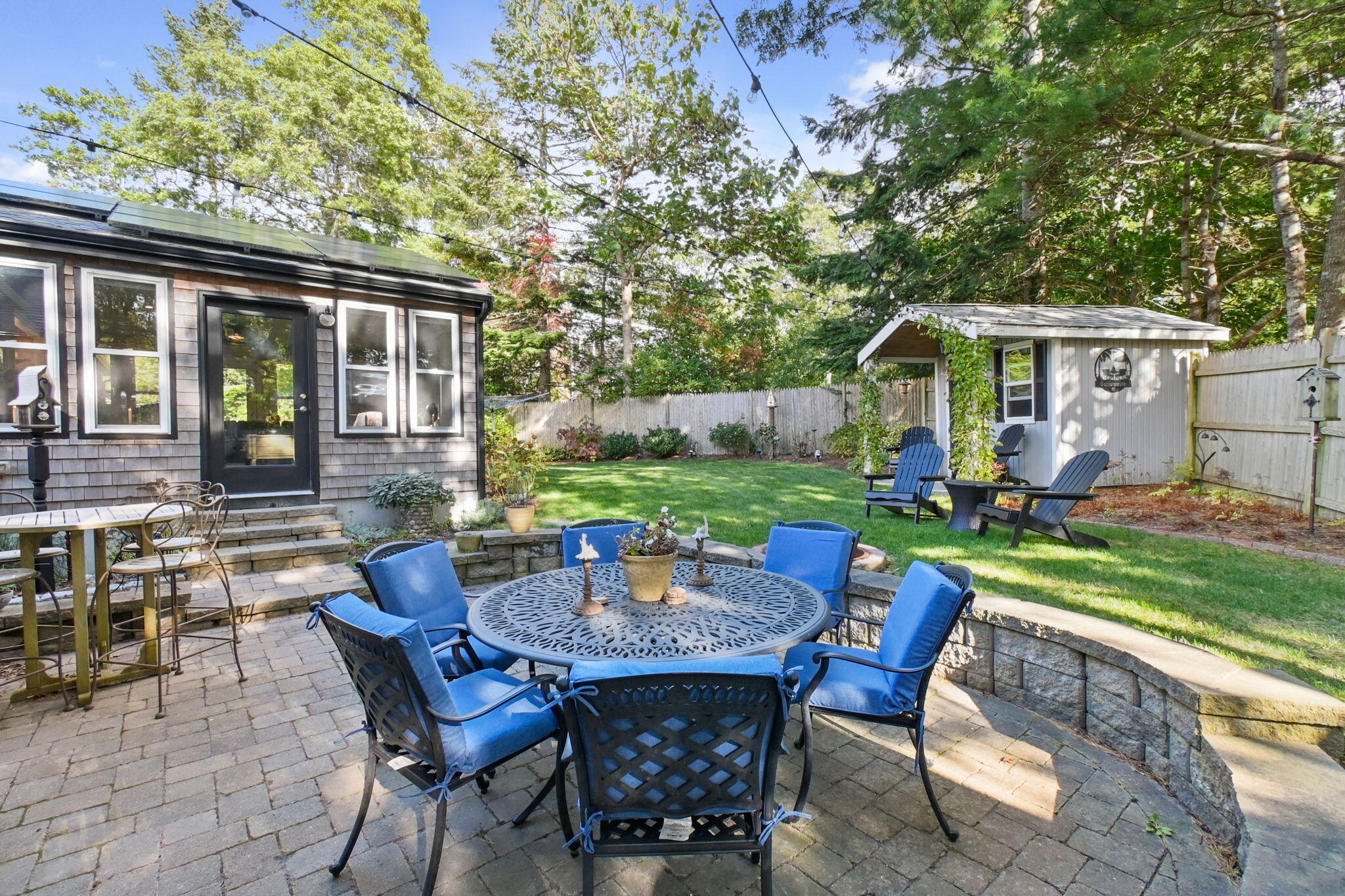 8 Jib Way Hyannis, MA 02601 - Photo 33 of 40 a view of a patio with a table chairs and a backyard