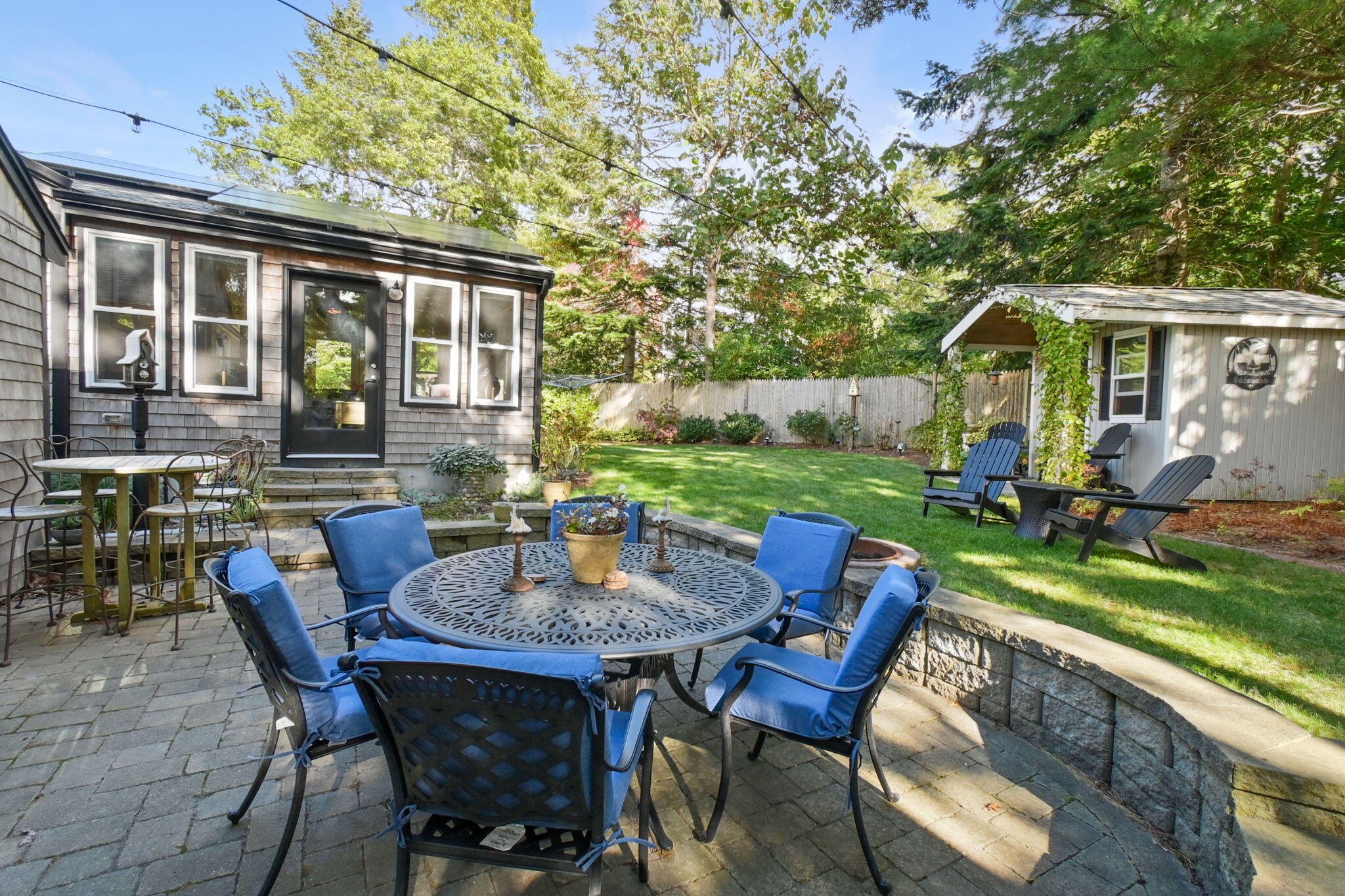 8 Jib Way Hyannis, MA 02601 - Photo 34 of 40 a view of a patio with a table chairs and a backyard