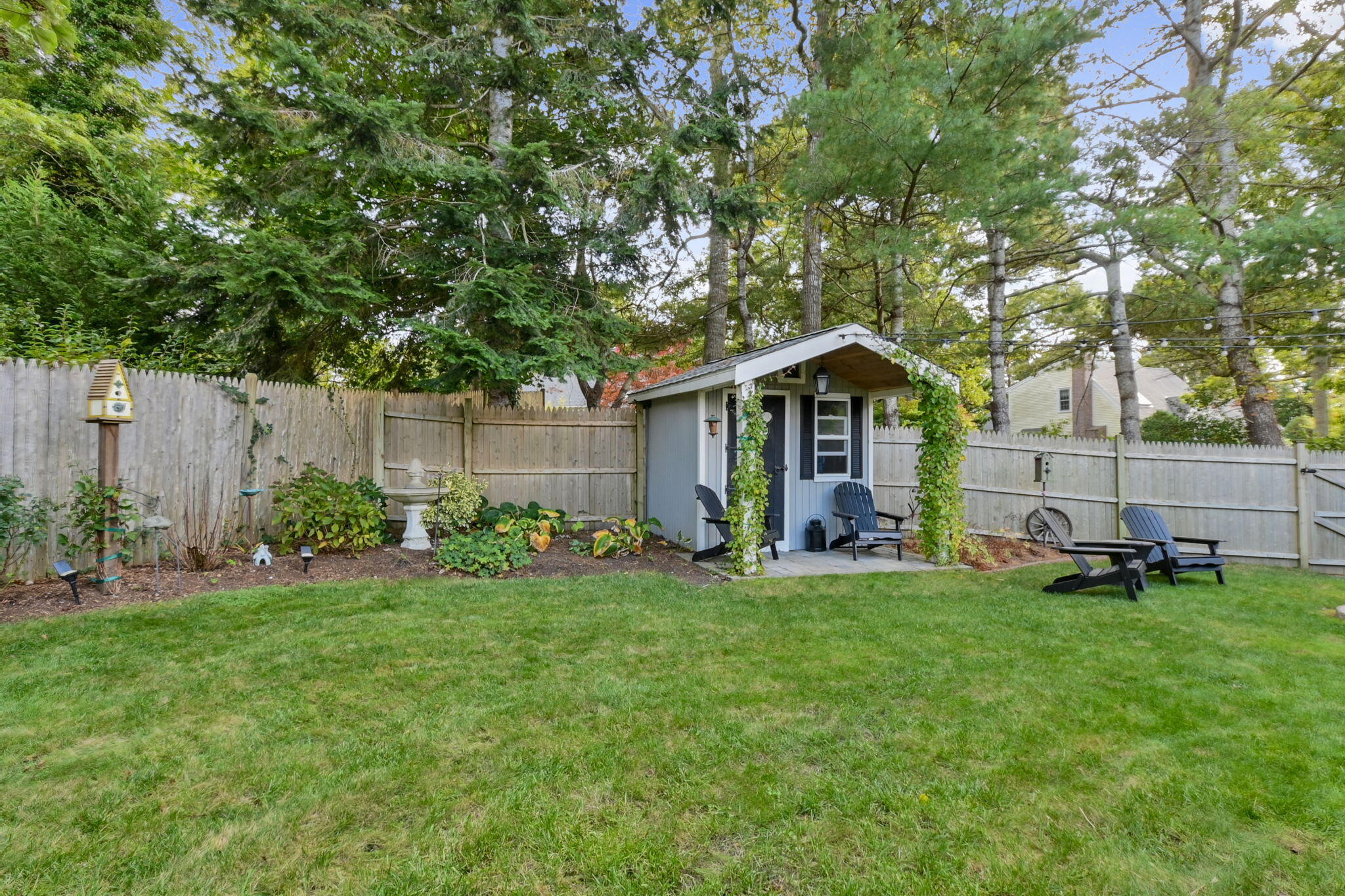 8 Jib Way Hyannis, MA 02601 - Photo 37 of 40 a front view of a house with a yard and trees