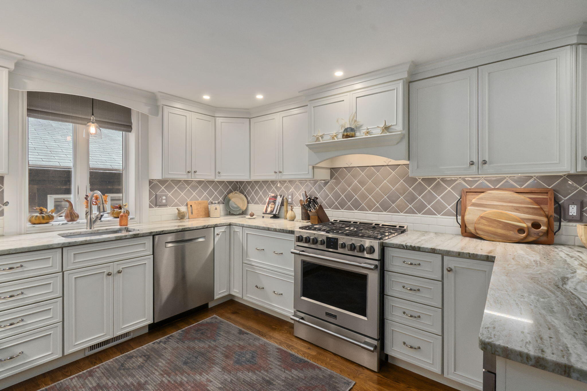 8 Jib Way Hyannis, MA 02601 - Photo 8 of 40 a kitchen with granite countertop cabinets stainless steel appliances and a sink