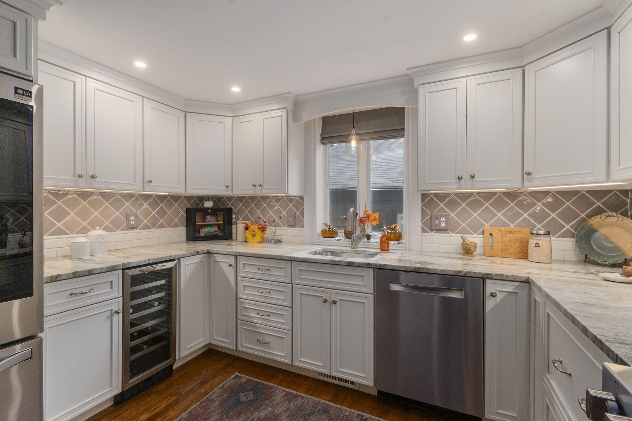 8 Jib Way Hyannis, MA 02601 - Photo 10 of 40 a kitchen with sink cabinets and window