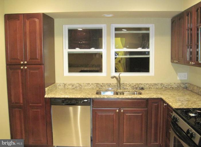 3409 Reedy Drive Annandale, VA 22003 - Photo 11 of 30 a bathroom with a granite countertop sink and a mirror