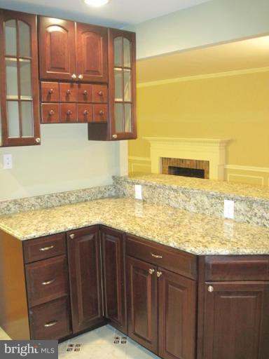 3409 Reedy Drive Annandale, VA 22003 - Photo 12 of 30 a bathroom with a granite countertop sink and a mirror