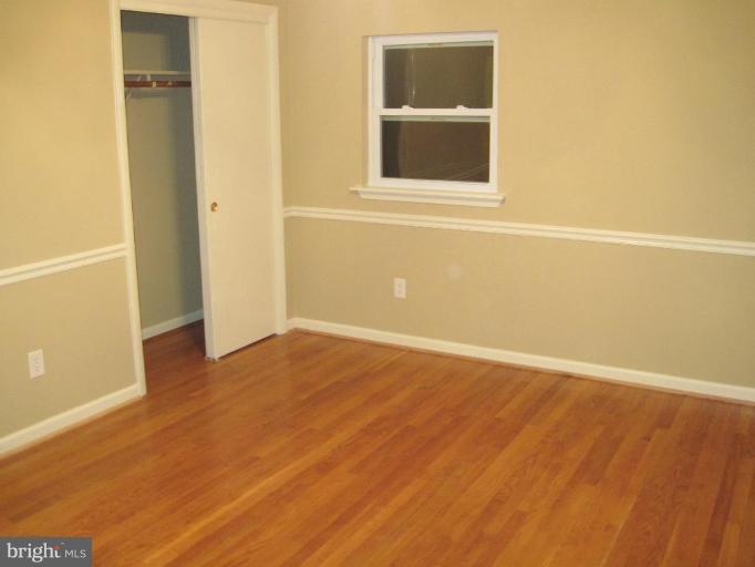 3409 Reedy Drive Annandale, VA 22003 - Photo 15 of 30 a view of an empty room with wooden floor and a window