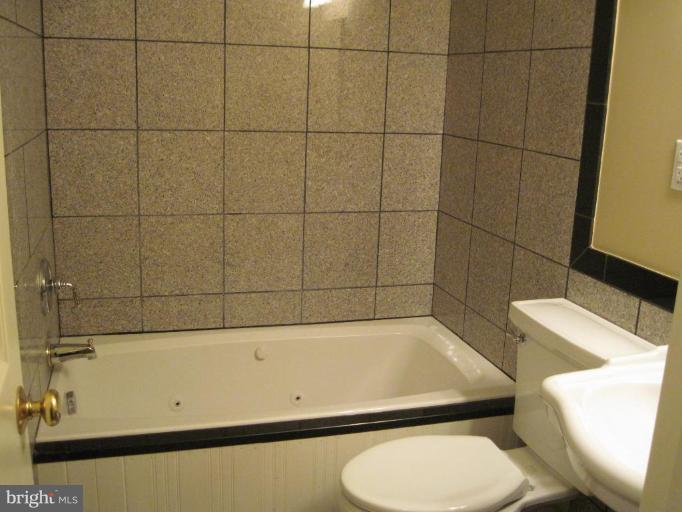 3409 Reedy Drive Annandale, VA 22003 - Photo 18 of 30 a bathroom with a toilet and a shower