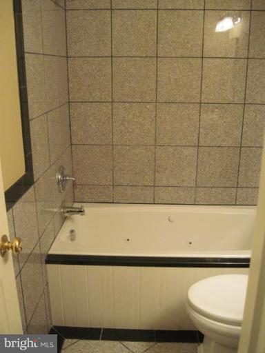 3409 Reedy Drive Annandale, VA 22003 - Photo 20 of 30 a bathroom with a toilet a sink and a shower