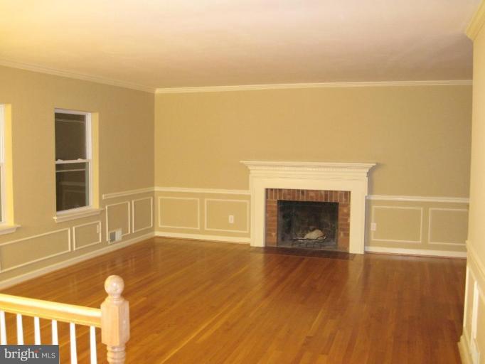 3409 Reedy Drive Annandale, VA 22003 - Photo 3 of 30 a view of an empty room with wooden floor and a window
