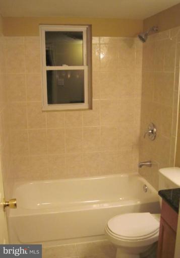 3409 Reedy Drive Annandale, VA 22003 - Photo 28 of 30 a bathroom with a toilet and a shower