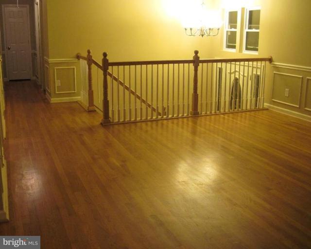 3409 Reedy Drive Annandale, VA 22003 - Photo 5 of 30 a view of a balcony with floor to ceiling window and wooden floor